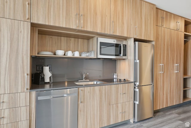 2670 Canyons Resort Dr Unit 127, Park City, UT 84098 - kitchen featuring light brown cabinetry, a sink, open shelves, and appliances with stainless steel finishes