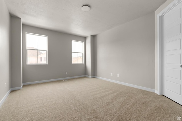2982 S Craner Peak Dr, Magna, UT 84044 - unfurnished room featuring light colored carpet and baseboards
