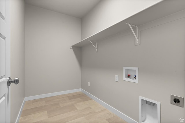 2982 S Craner Peak Dr, Magna, UT 84044 - clothes washing area with laundry area, light wood-style flooring, hookup for an electric dryer, washer hookup, and baseboards