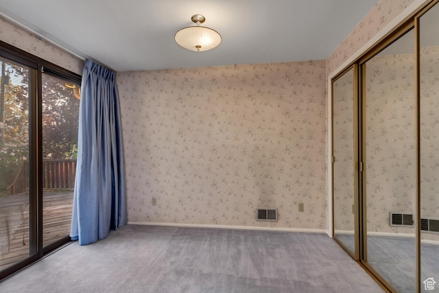 6796 S Nye Dr, Cottonwood Heights, UT 84121 - empty room with visible vents, wallpapered walls, and carpet flooring