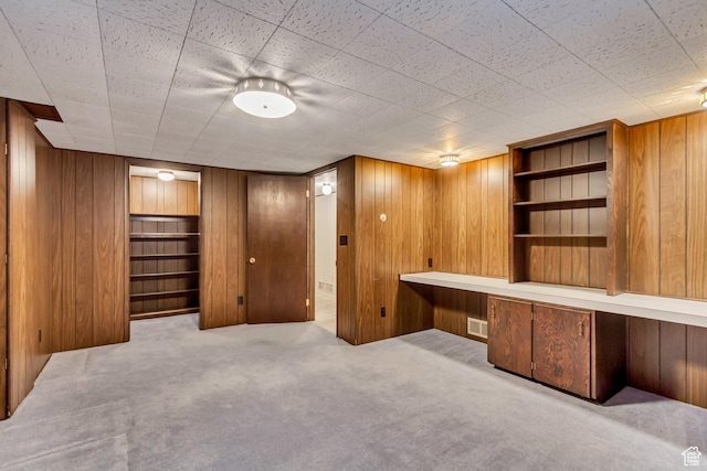6796 S Nye Dr, Cottonwood Heights, UT 84121 - unfurnished office featuring wood walls, carpet, visible vents, and built in shelves