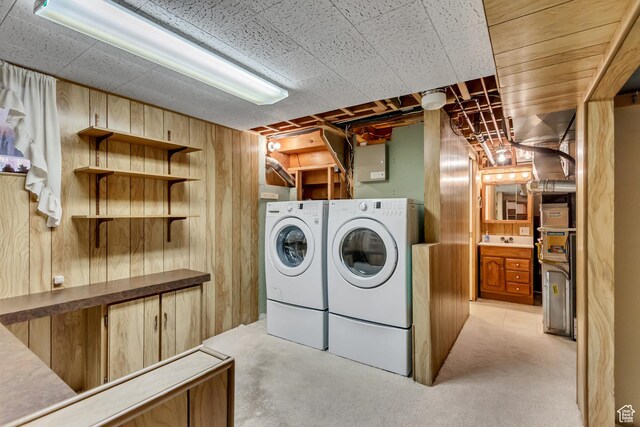 6796 S Nye Dr, Cottonwood Heights, UT 84121 - laundry room with washing machine and clothes dryer, wood walls, and laundry area