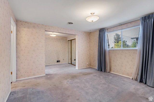 6796 S Nye Dr, Cottonwood Heights, UT 84121 - empty room featuring visible vents, wallpapered walls, and carpet floors
