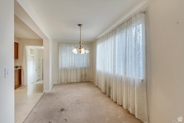 6796 S Nye Dr, Cottonwood Heights, UT 84121 - unfurnished dining area featuring a notable chandelier and plenty of natural light