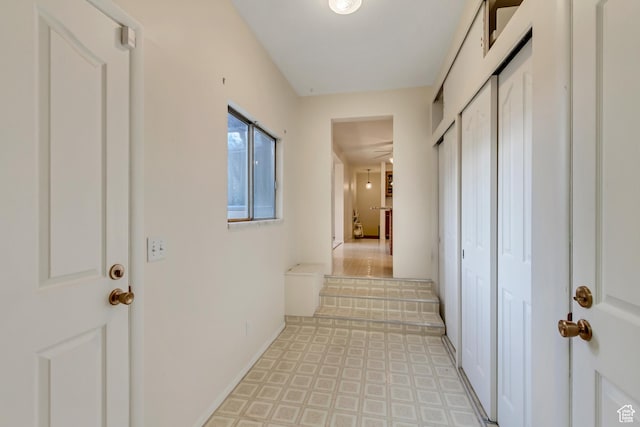 6796 S Nye Dr, Cottonwood Heights, UT 84121 - hallway featuring baseboards and light floors
