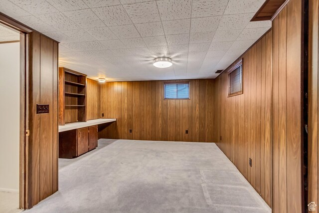 6796 S Nye Dr, Cottonwood Heights, UT 84121 - basement featuring wood walls and carpet floors