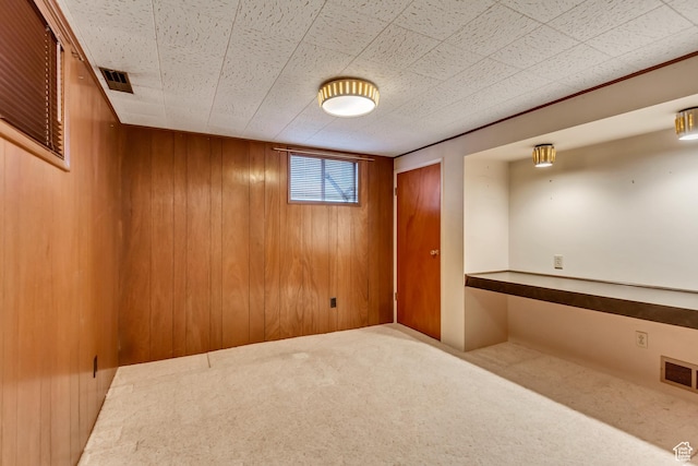 6796 S Nye Dr, Cottonwood Heights, UT 84121 - below grade area with visible vents, wooden walls, and carpet