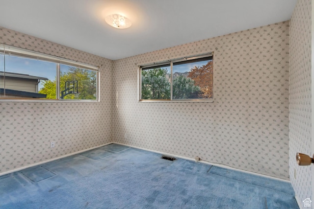 6796 S Nye Dr, Cottonwood Heights, UT 84121 - carpeted spare room with visible vents and wallpapered walls