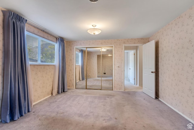6796 S Nye Dr, Cottonwood Heights, UT 84121 - unfurnished bedroom with a closet, wallpapered walls, and carpet floors