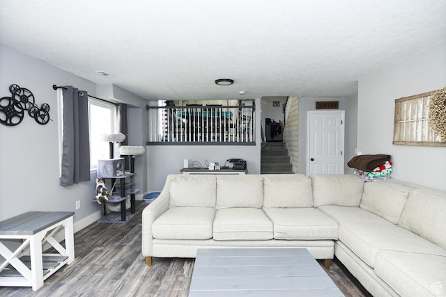 26 Orchard Ln S, Grantsville, UT 84029 - living area with baseboards, a textured ceiling, visible vents, and wood finished floors