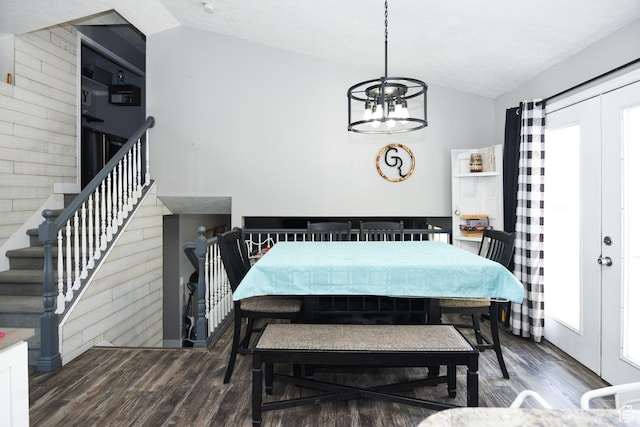 26 Orchard Ln S, Grantsville, UT 84029 - dining space featuring wooden walls, a chandelier, wood finished floors, lofted ceiling, and stairway
