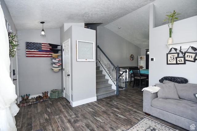26 Orchard Ln S, Grantsville, UT 84029 - living room with a textured ceiling, wood finished floors, baseboards, lofted ceiling, and stairs