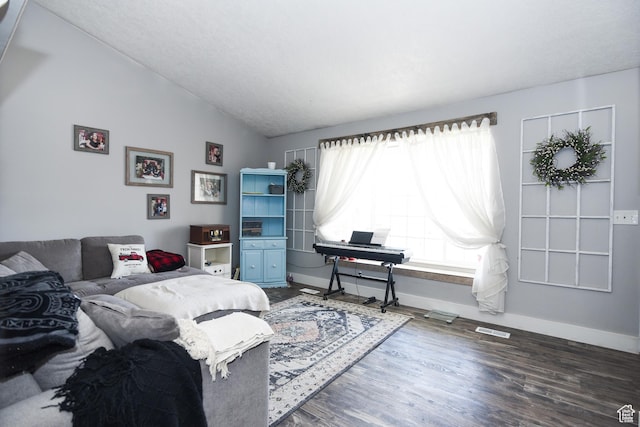 26 Orchard Ln S, Grantsville, UT 84029 - bedroom with baseboards, visible vents, wood finished floors, and lofted ceiling