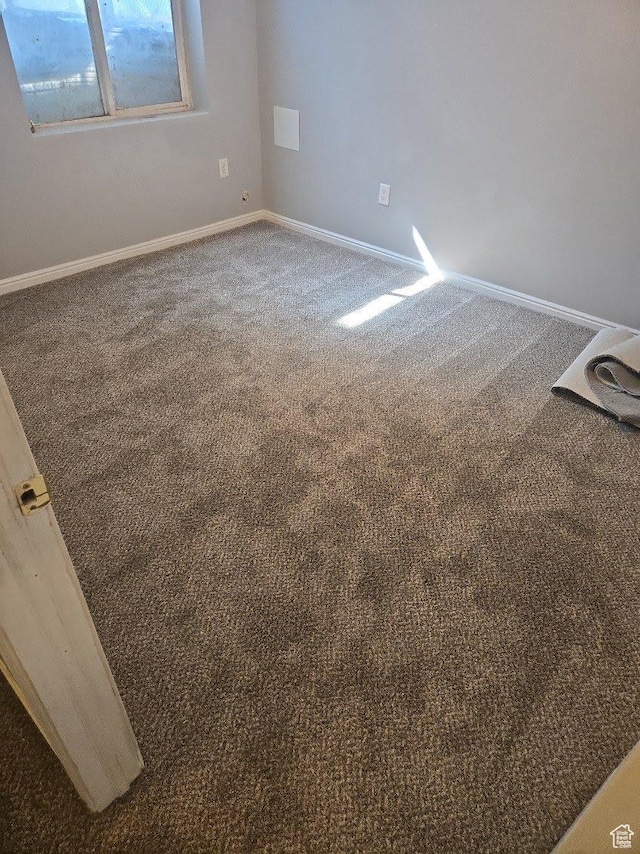 26 Orchard Ln S, Grantsville, UT 84029 - empty room featuring carpet floors and baseboards