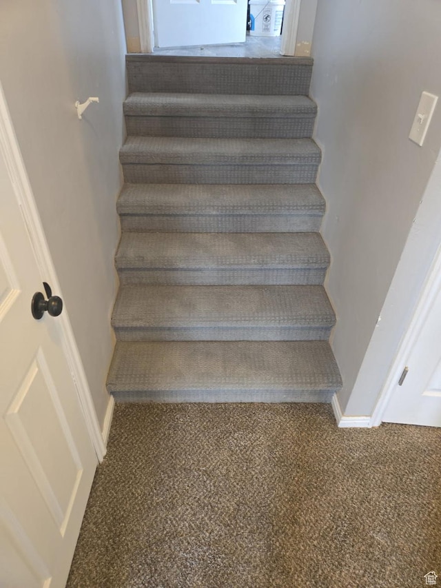 26 Orchard Ln S, Grantsville, UT 84029 - staircase featuring baseboards and carpet flooring