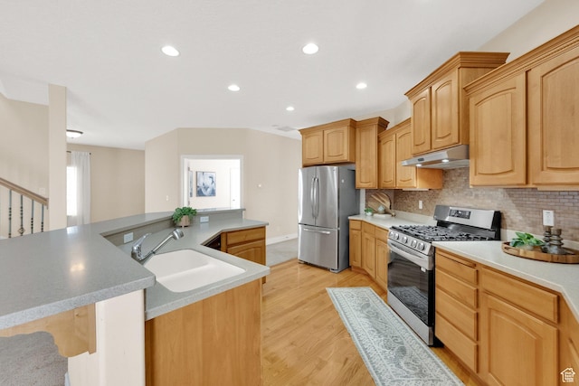 6872 S Triumph Ln, West Jordan, UT 84088 - kitchen featuring stainless steel appliances, under cabinet range hood, decorative backsplash, light wood finished floors, and recessed lighting