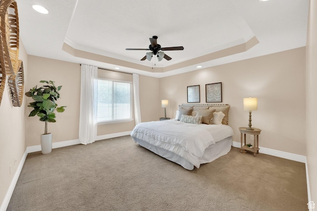 6872 S Triumph Ln, West Jordan, UT 84088 - carpeted bedroom with a tray ceiling, baseboards, recessed lighting, a ceiling fan, and crown molding