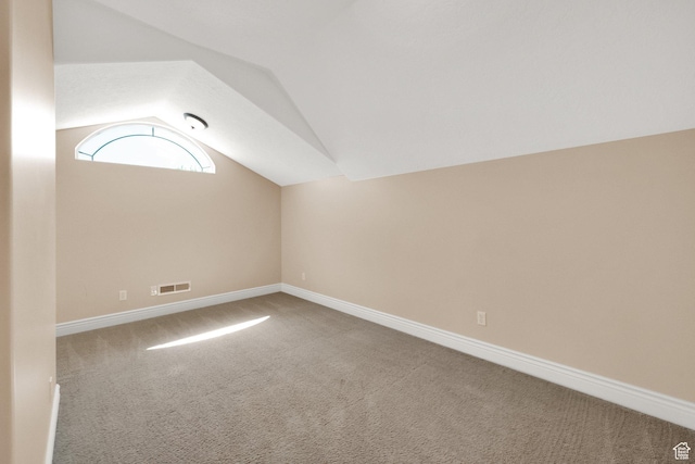 6872 S Triumph Ln, West Jordan, UT 84088 - bonus room featuring carpet flooring, lofted ceiling, and baseboards