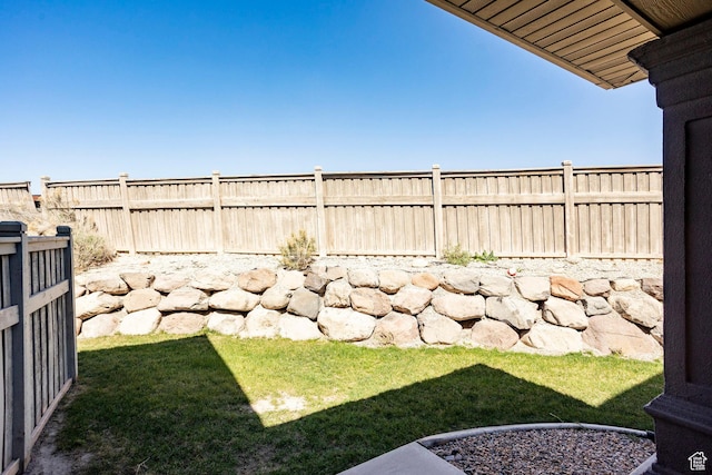 view of yard with a fenced backyard