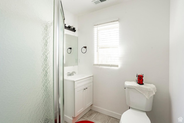 bathroom with vanity, toilet, visible vents, baseboards, and tile patterned flooring