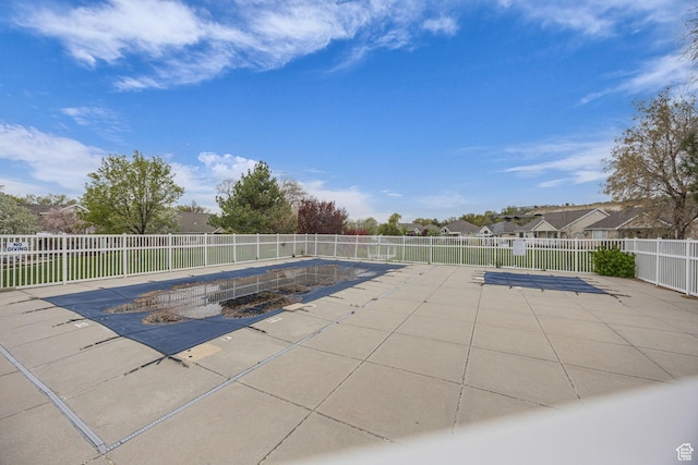 view of pool featuring a patio area and a fenced backyard