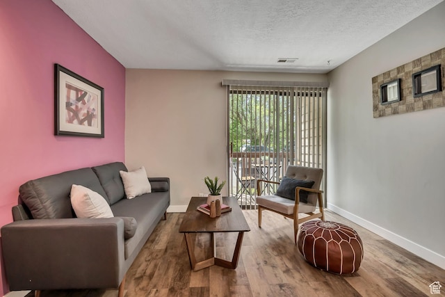 2270 E 4500 S Unit 2A, Holladay, UT 84117 - living area with baseboards, wood finished floors, and a textured ceiling