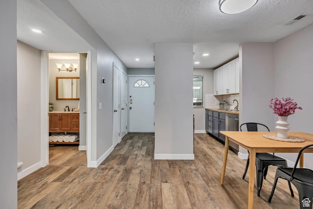 2270 E 4500 S Unit 2A, Holladay, UT 84117 - dining area with wood finished floors, baseboards, and a textured ceiling