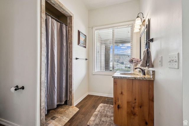 875 W Oak Ln, Francis, UT 84036 - bathroom featuring baseboards, wood finished floors, and vanity