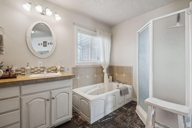 875 W Oak Ln, Francis, UT 84036 - full bathroom with a stall shower, a tub with jets, vanity, marble finish floor, and backsplash
