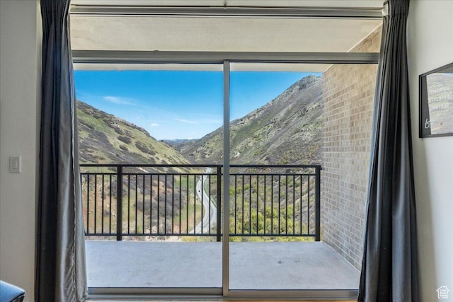 875 S Donner Way Unit 1208, Salt Lake City, UT 84108 - doorway to outside featuring a mountain view and plenty of natural light