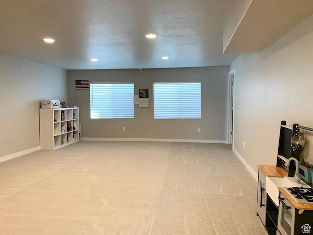 4190 W Penstemon Way, Lehi, UT 84043 - living area with light colored carpet, recessed lighting, and baseboards