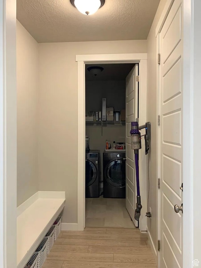 4190 W Penstemon Way, Lehi, UT 84043 - laundry room featuring a textured ceiling, separate washer and dryer, laundry area, and light wood finished floors