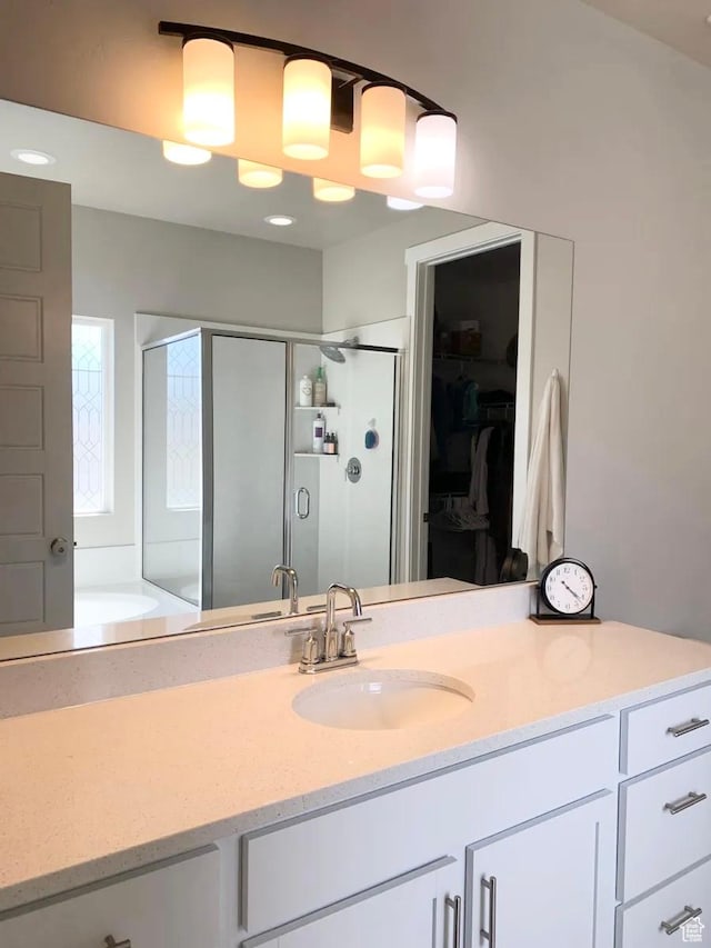 4190 W Penstemon Way, Lehi, UT 84043 - bathroom featuring a spacious closet, a stall shower, a garden tub, and vanity