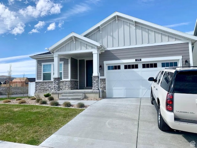 4190 W Penstemon Way, Lehi, UT 84043 - craftsman-style house featuring a front lawn, stone siding, an attached garage, and board and batten siding