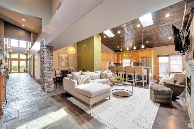 3200 E 3900 S, Salt Lake City, UT 84124 - living room with high vaulted ceiling, a skylight, ornate columns, and recessed lighting