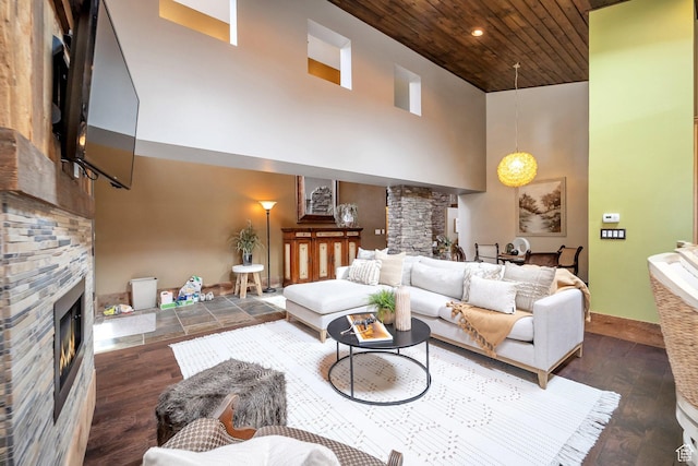 3200 E 3900 S, Salt Lake City, UT 84124 - living room featuring wood finished floors, wood ceiling, a stone fireplace, baseboards, and a towering ceiling
