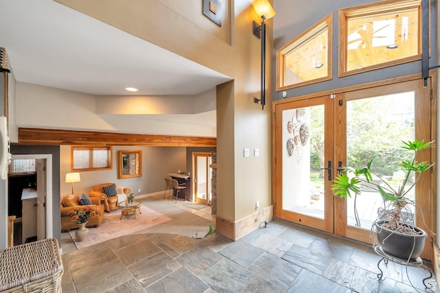 3200 E 3900 S, Salt Lake City, UT 84124 - foyer featuring a towering ceiling, stone tile flooring, recessed lighting, and baseboards