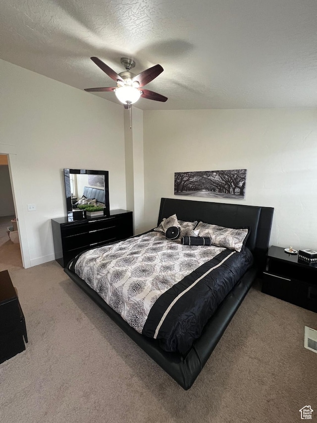 carpeted bedroom featuring a ceiling fan