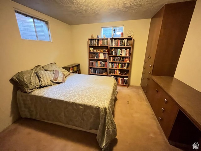 397 W 4125 N, Pleasant View, UT 84414 - bedroom featuring light carpet and a textured ceiling