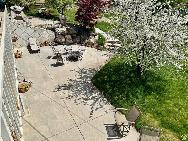 397 W 4125 N, Pleasant View, UT 84414 - view of patio / terrace with a fire pit