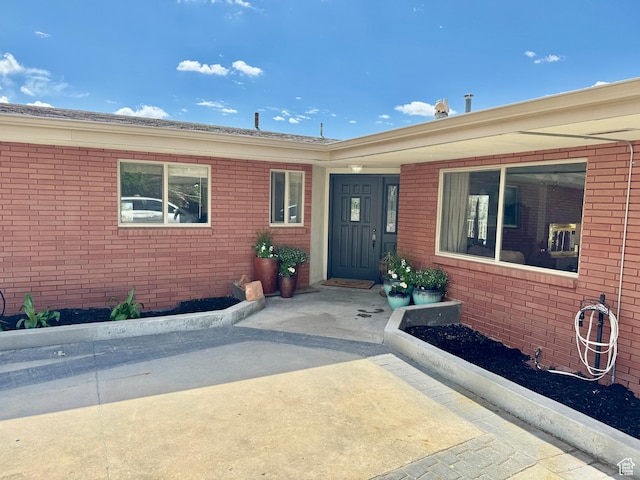 397 W 4125 N, Pleasant View, UT 84414 - view of exterior entry featuring brick siding