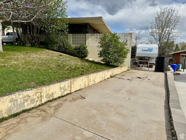 397 W 4125 N, Pleasant View, UT 84414 - view of side of home with a lawn and fence