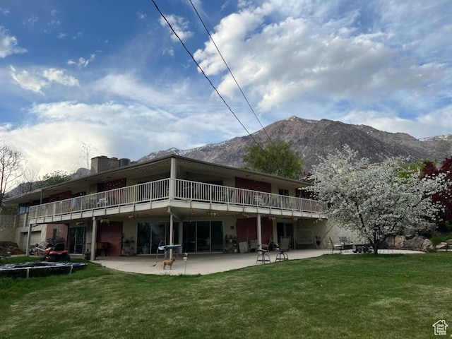 397 W 4125 N, Pleasant View, UT 84414 - rear view of property featuring a yard, a patio, and a mountain view