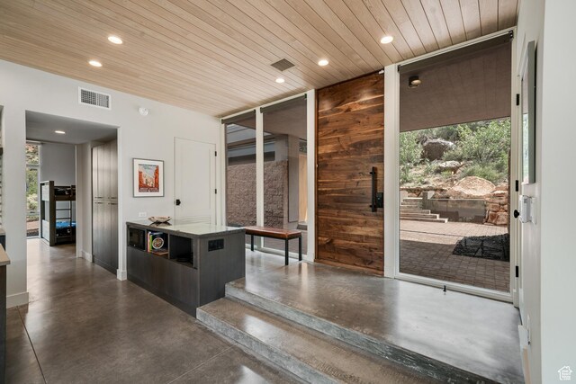 112 Canyon Cv, Springdale, UT 84767 - interior space with visible vents, finished concrete flooring, wooden ceiling, and a healthy amount of sunlight
