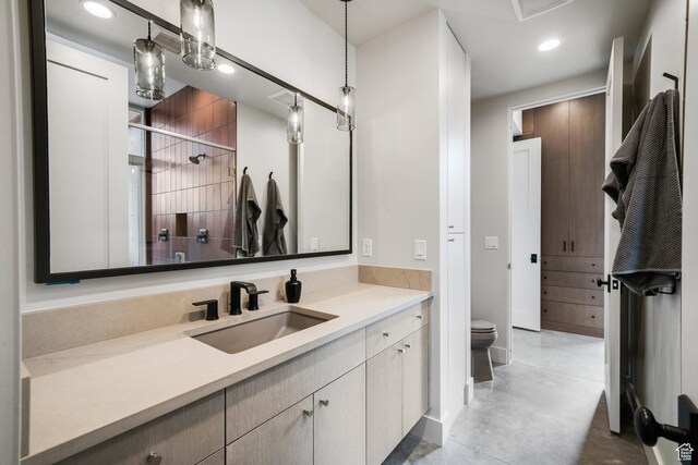 112 Canyon Cv, Springdale, UT 84767 - full bath featuring recessed lighting, a shower stall, vanity, toilet, and finished concrete floors