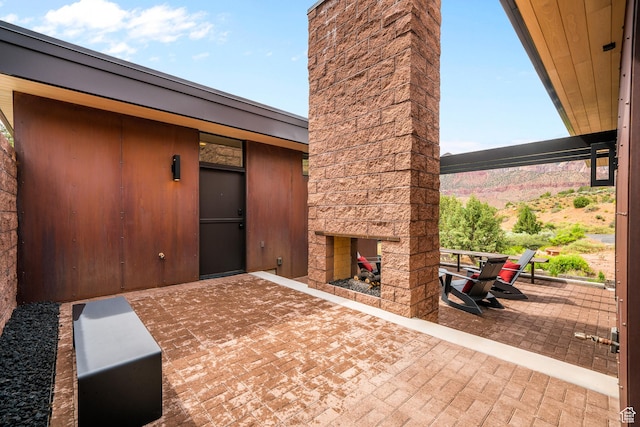 112 Canyon Cv, Springdale, UT 84767 - view of patio with an outdoor stone fireplace