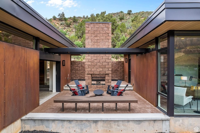 112 Canyon Cv, Springdale, UT 84767 - view of patio / terrace featuring an outdoor stone fireplace