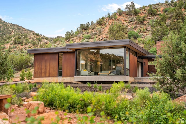 112 Canyon Cv, Springdale, UT 84767 - rear view of property with a sunroom and a mountain view