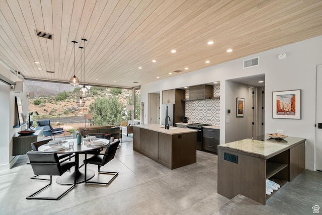 112 Canyon Cv, Springdale, UT 84767 - kitchen featuring wooden ceiling, open shelves, a center island with sink, light countertops, and appliances with stainless steel finishes