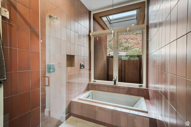 112 Canyon Cv, Springdale, UT 84767 - full bathroom featuring a skylight, a garden tub, and tile walls